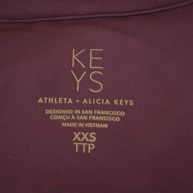 Athleta Alicia Keys Goddess Purple Rib Long Sleeve Zip Up Bodysuit Jumpsuit XXS